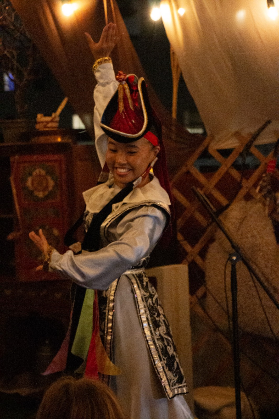 Dancer in traditional Mongolian costume mid-performance
